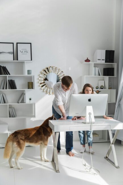 Woman and man setting up computer